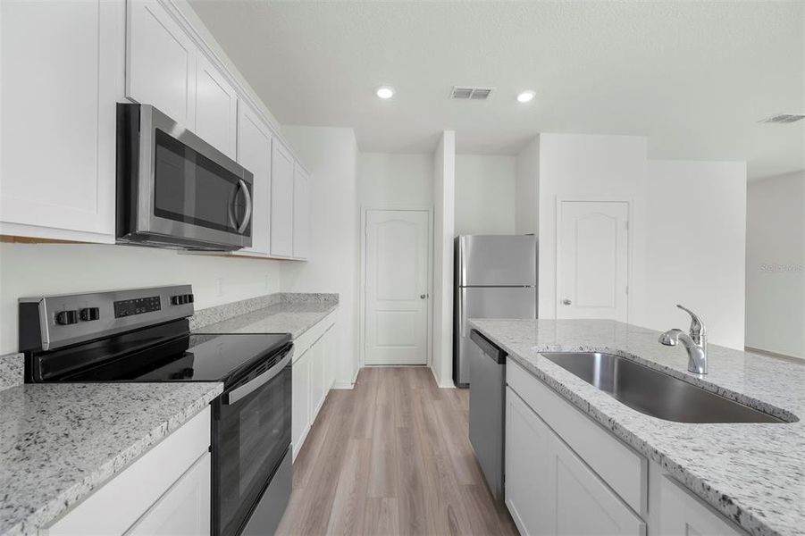 Furnished interior view inside a new home in Peach Crossings, Winter Haven (Image 5).