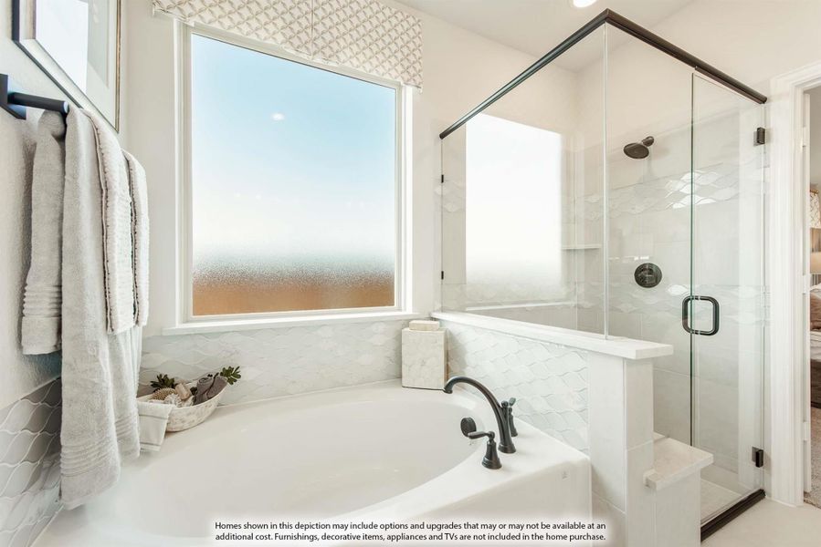 Bathroom with soaking tub, glass-enclosed shower, white tile walls, and large window