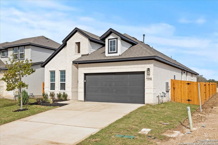 Front exterior of a new home in Stream Waters, Seguin, TX, highlighting curb appeal (Image 18). Front exterior of a new home in Stream Waters, Seguin, TX, highlighting curb appeal (Image 18).