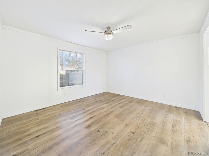 Bedroom #1 This serene bedroom retreat features soft-toned flooring, a neutral palette, and an ensuite bath access.