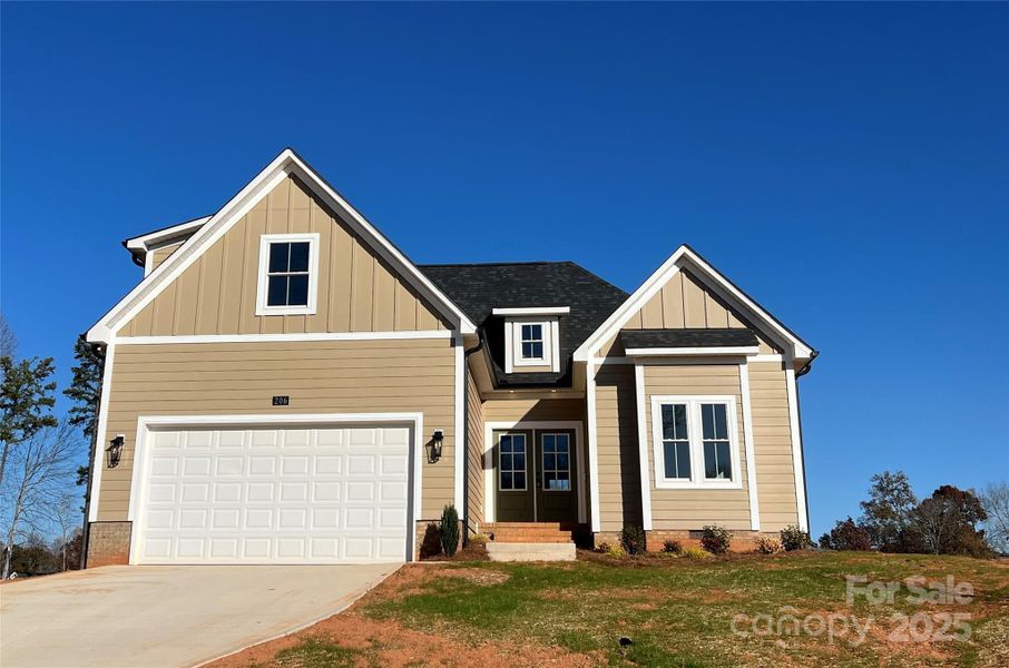 Front exterior of a new home in , China Grove, NC, highlighting curb appeal (Image 1).