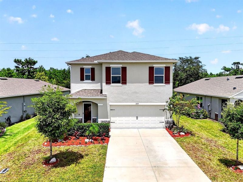 Front exterior of a new home in , Ormond Beach, FL, highlighting curb appeal (Image 23). Front exterior of a new home in , Ormond Beach, FL, highlighting curb appeal (Image 23).
