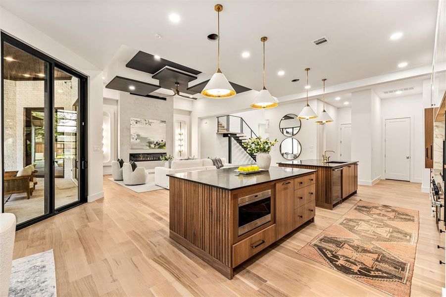 The open connection between the kitchen and living area makes this space ideal for entertaining, allowing conversations to flow easily while meals are prepared