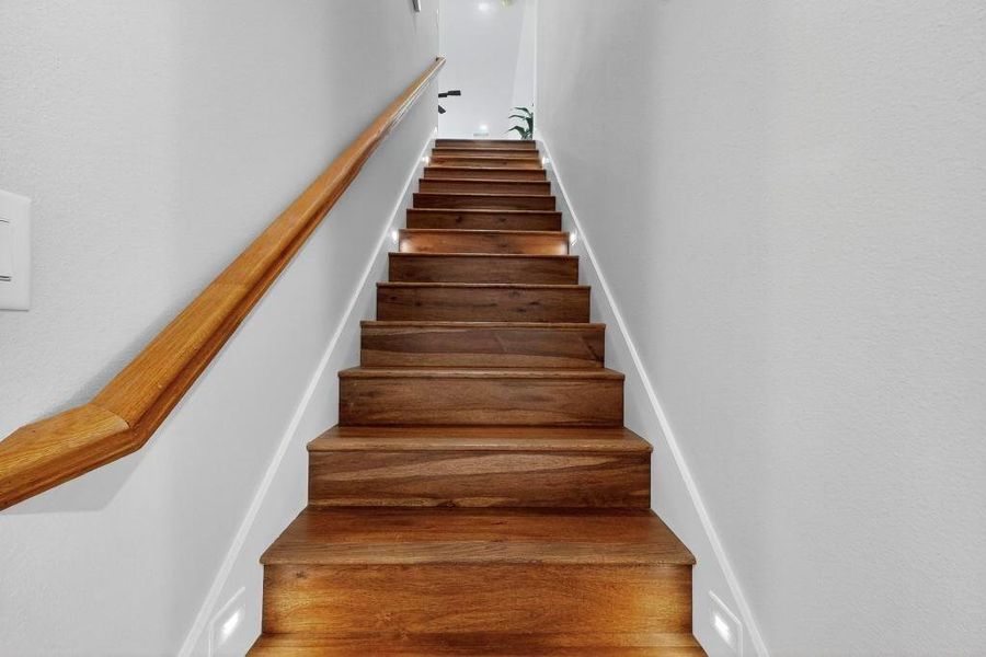 Staircase with wood finished floors