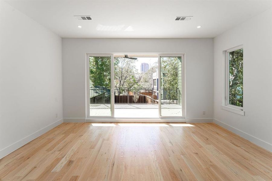 Empty room with light wood-type flooring