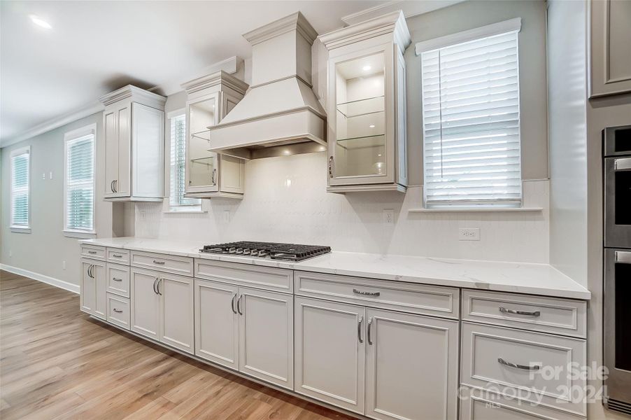 Kitchen with Smoke Vent and Gas Cooktop