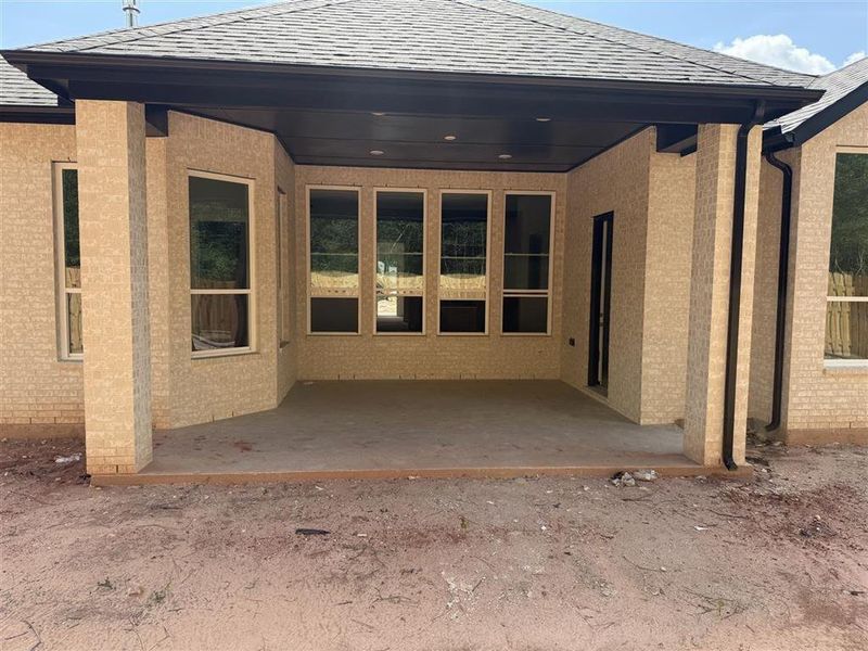 Front exterior of a new home in COLTON: 60ft. lots, Magnolia, TX, highlighting curb appeal (Image 1).