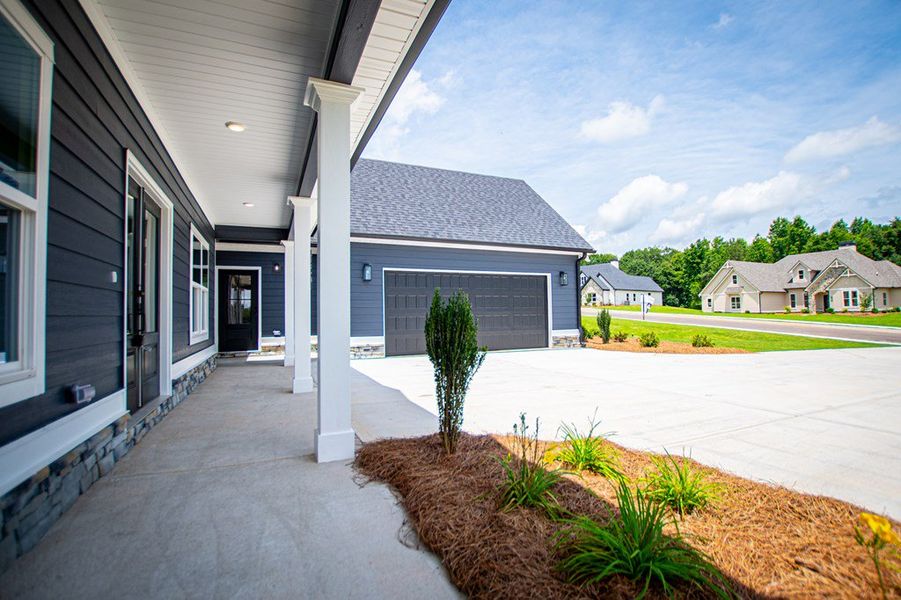 Exterior details and patio area of a home in WOODMONT RESERVE, Roopville (Image 40).