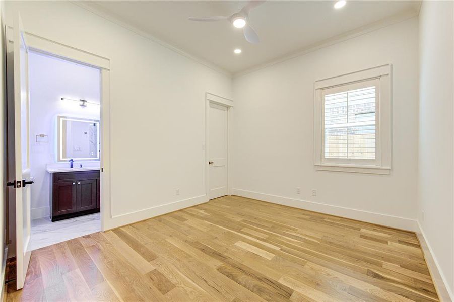 Guest Suite across the hallway from the Dining. All bedrooms have Plantation Window Shutters