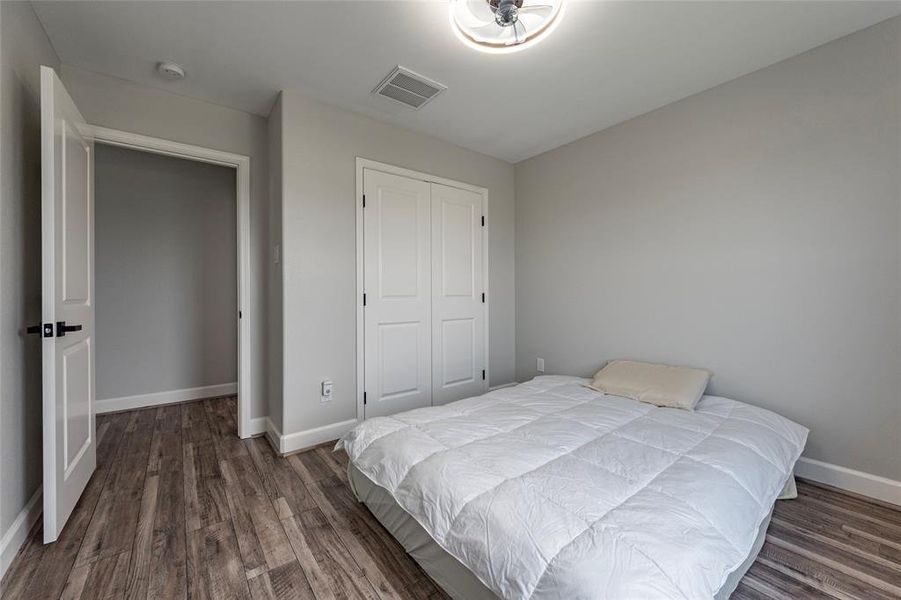 Upstairs, two generously sized bedrooms provide comfort and privacy, with ample closet space and serene views of the surrounding area.