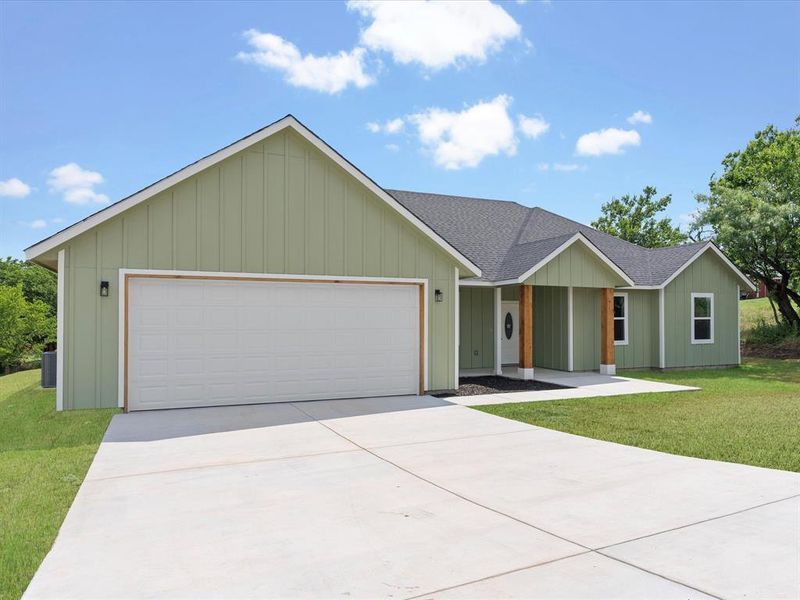 Front exterior of a new home in , Runaway Bay, TX, highlighting curb appeal (Image 16).