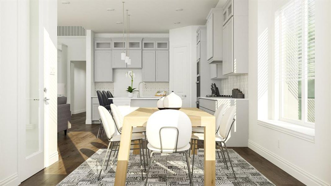 Dining room with a healthy amount of sunlight and dark hardwood / wood-style flooring