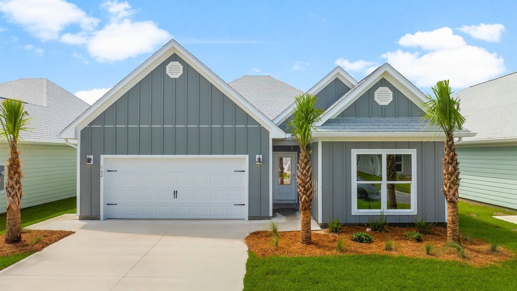 Front exterior of a new home in WindMark Beach, Port Saint Joe, FL, highlighting curb appeal (Image 1). Front exterior of a new home in WindMark Beach, Port Saint Joe, FL, highlighting curb appeal (Image 1).