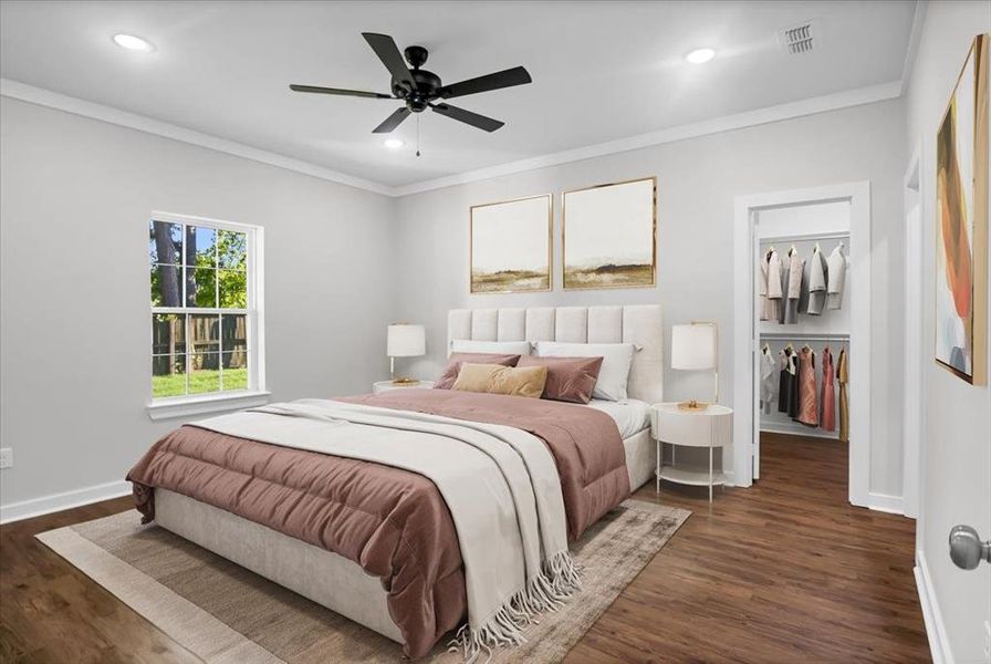 Bedroom featuring ornamental molding, a walk in closet, dark wood-style floors, recessed lighting, and ceiling fan