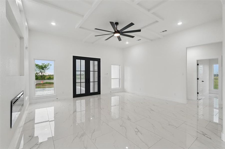 Unfurnished room with french doors, a ceiling fan, healthy amount of natural light, baseboards, and recessed lighting Unfurnished room with french doors, a ceiling fan, healthy amount of natural light, baseboards, and recessed lighting