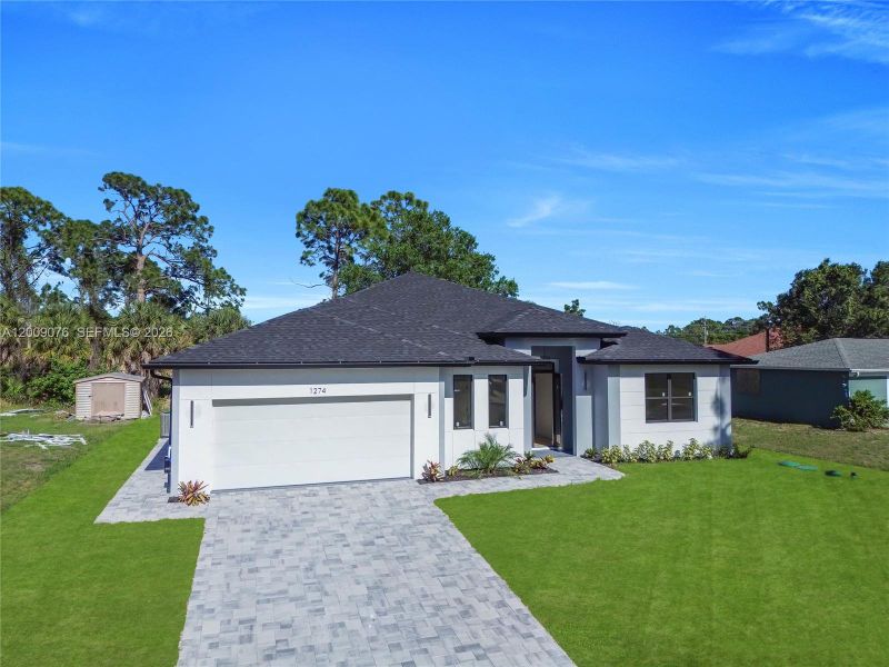 Front exterior of a new home in , North Port, FL, highlighting curb appeal (Image 24).