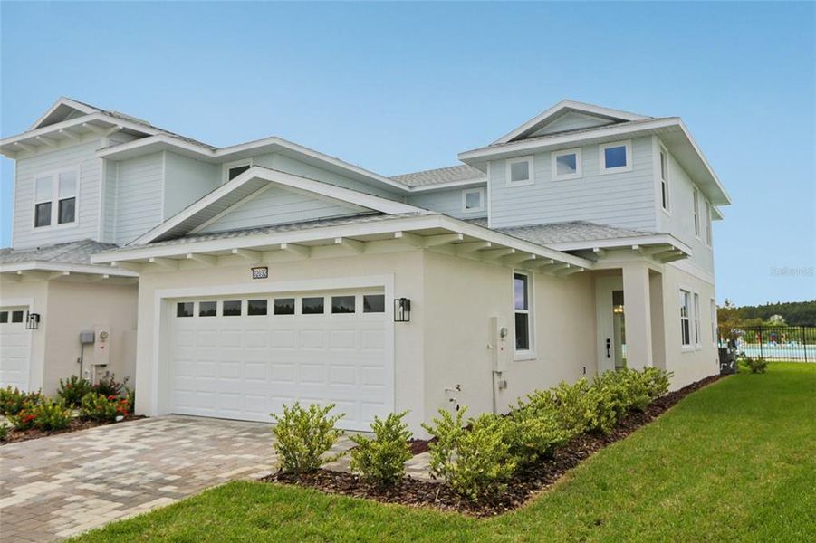 Exterior details and patio area of a home in Lagoon Residences at Epperson, Wesley Chapel (Image 27).