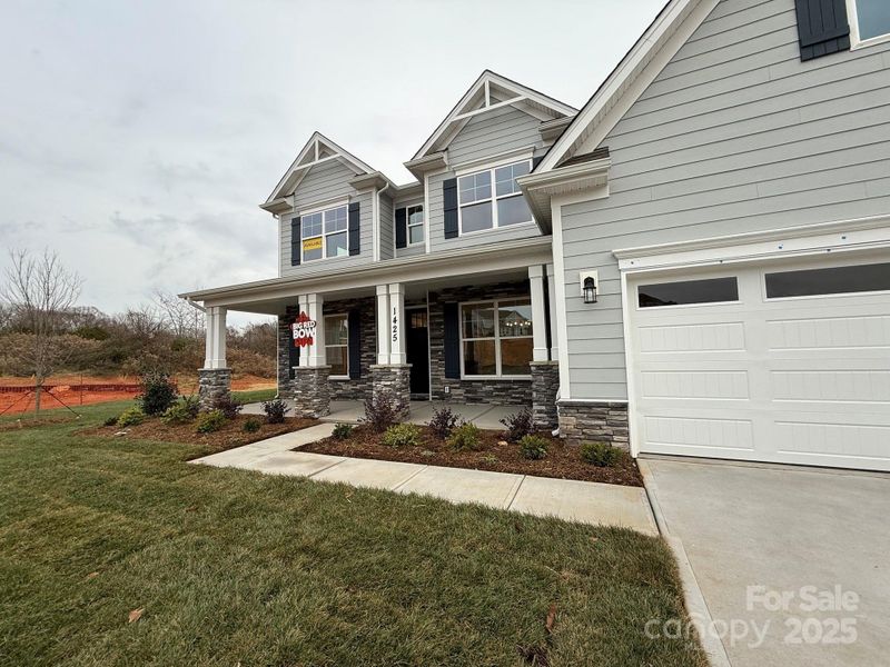 Front exterior of a new home in Robinson Oaks, Gastonia, NC, highlighting curb appeal (Image 2).