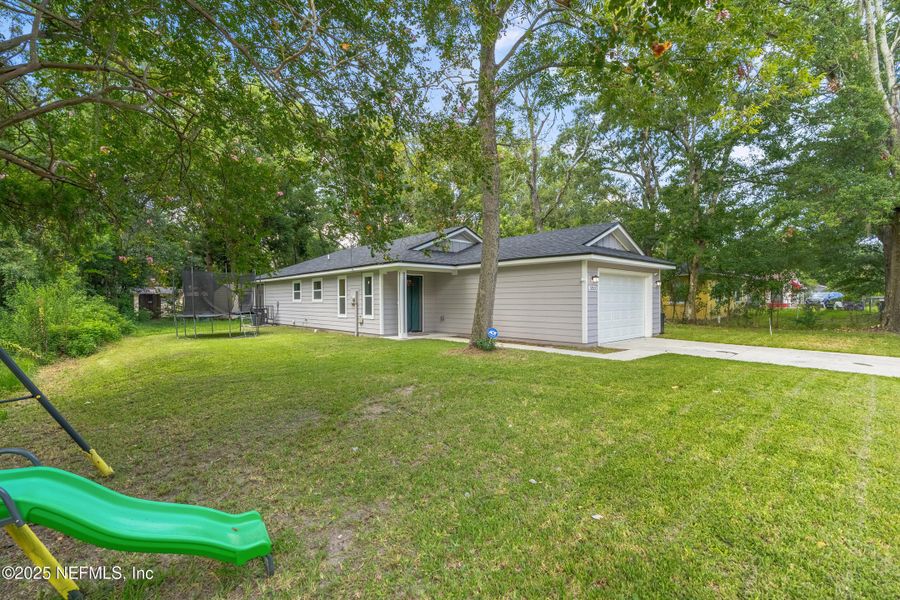 Front exterior of a new home in , Jacksonville, FL, highlighting curb appeal (Image 19).