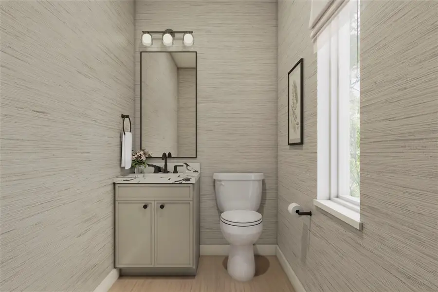 Bathroom featuring vanity and tile walls