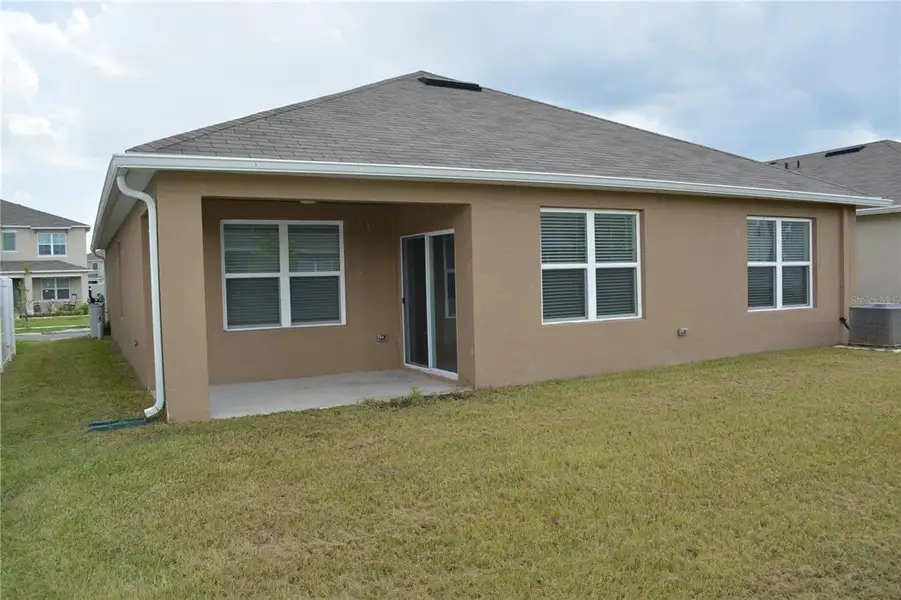 Front exterior of a new home in , Lakeland, FL, highlighting curb appeal (Image 15).