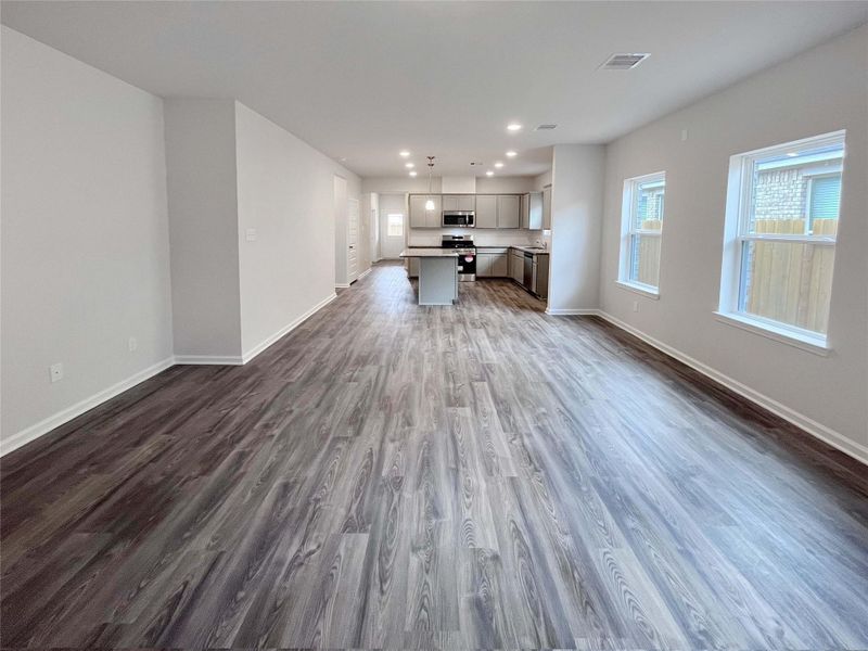 The Mockingbird II- Family Room into Kitchen. Sample photo used for illustrative purposes only, options/colors will vary.