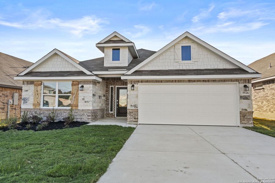 Front exterior of a new home in Gatehouse: Brookstone II Collection, New Braunfels, TX, highlighting curb appeal (Image 1). Front exterior of a new home in Gatehouse: Brookstone II Collection, New Braunfels, TX, highlighting curb appeal (Image 1).