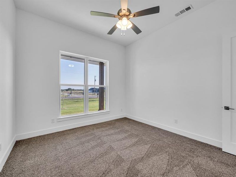 Unfurnished room with carpet floors and ceiling fan