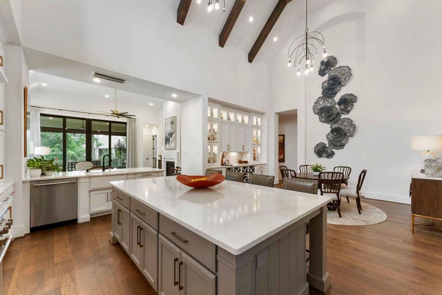 From this angle, the kitchen’s relationship to the dining area and custom built-ins is especially clear. The layout supports effortless hosting, with storage and serving space exactly where it is needed.