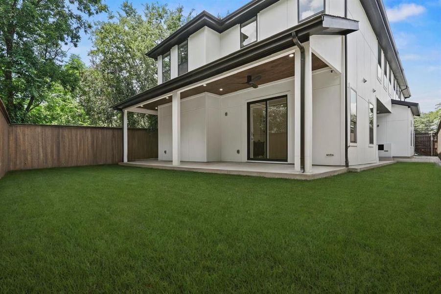 Back of house featuring a patio, a fenced backyard, and ceiling fan