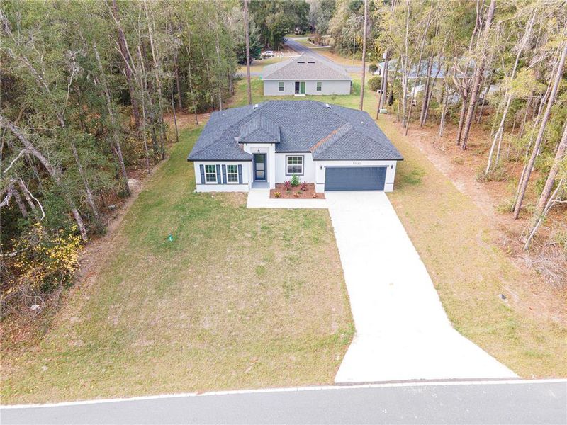 Front exterior of a new home in , Citrus Springs, FL, highlighting curb appeal (Image 18).