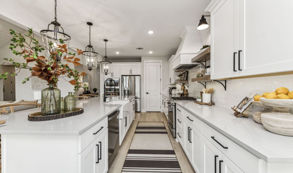 Gorgeous cabinets and pendant lighting illuminate your kitchen