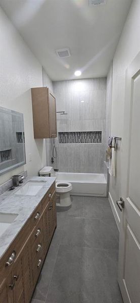 Full bathroom with double vanity and bathing tub / shower combination Full bathroom with double vanity and bathing tub / shower combination