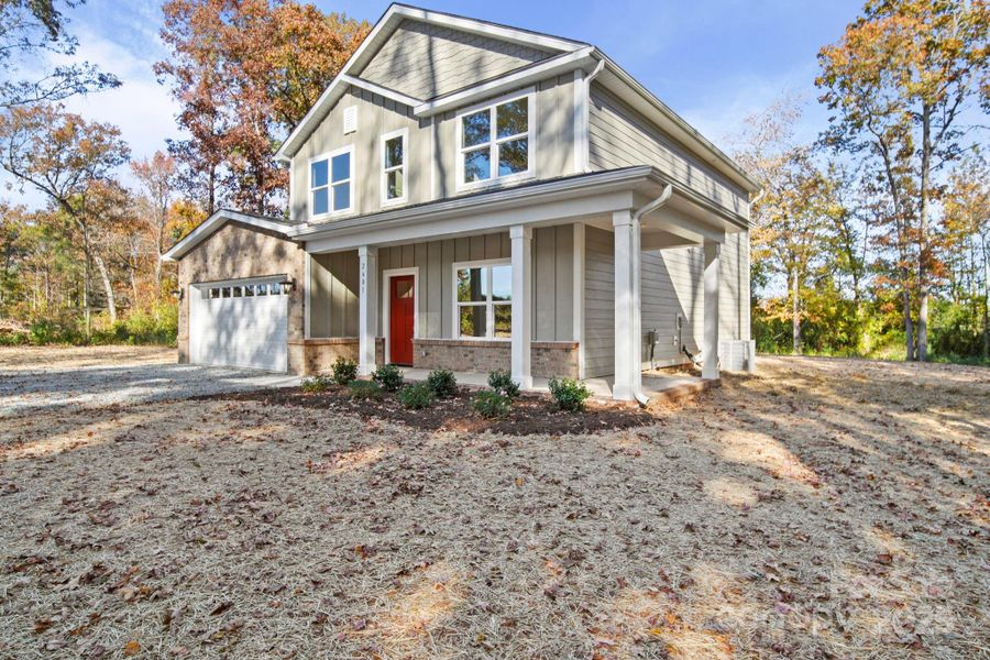 Front exterior of a new home in , Monroe, NC, highlighting curb appeal (Image 1).