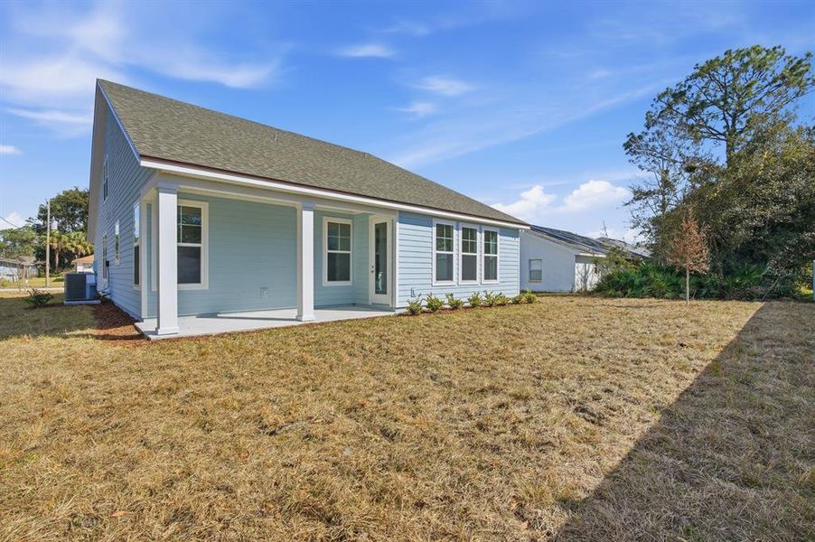 Exterior details and patio area of a home in Palm Coast Homes, Palm Coast (Image 3).
