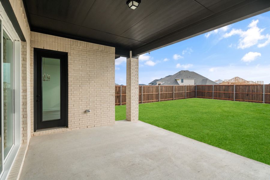 Exterior details and patio area of a home in Cambridge Crossing, Celina (Image 4).