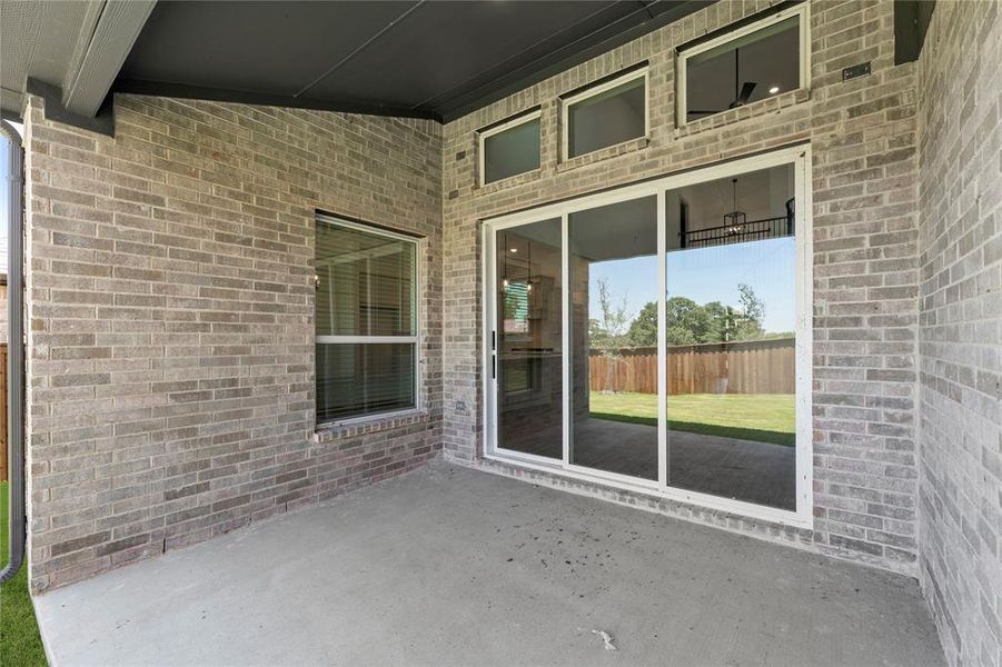 Front exterior of a new home in Spiritas Ranch, Little Elm, TX, highlighting curb appeal (Image 2).