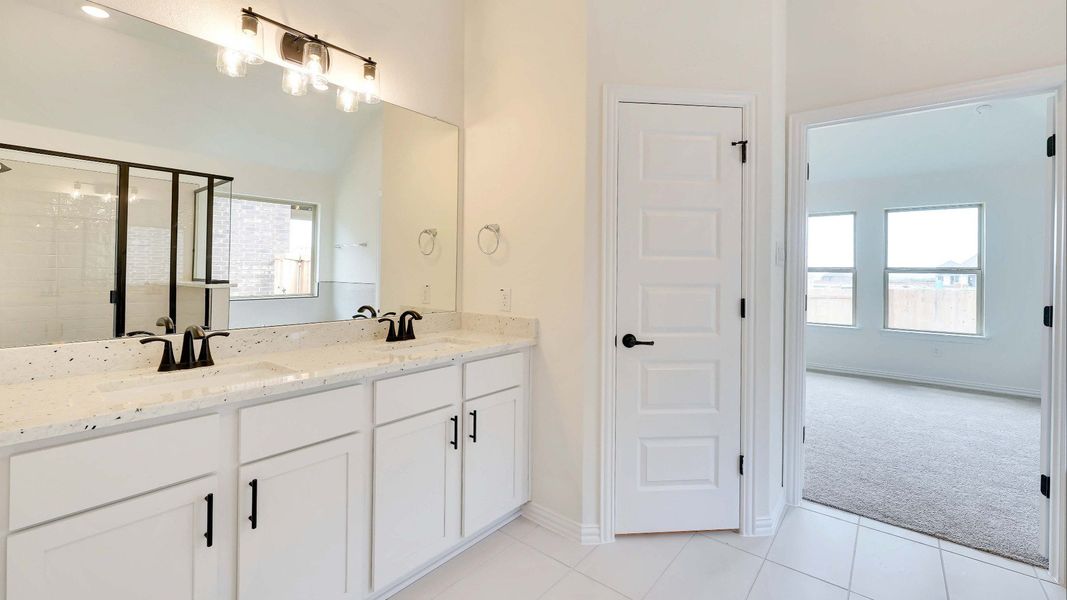 Representative furnished interior of a home built from the Palm by Brightland Homes in Sunterra, Katy (Image 9).