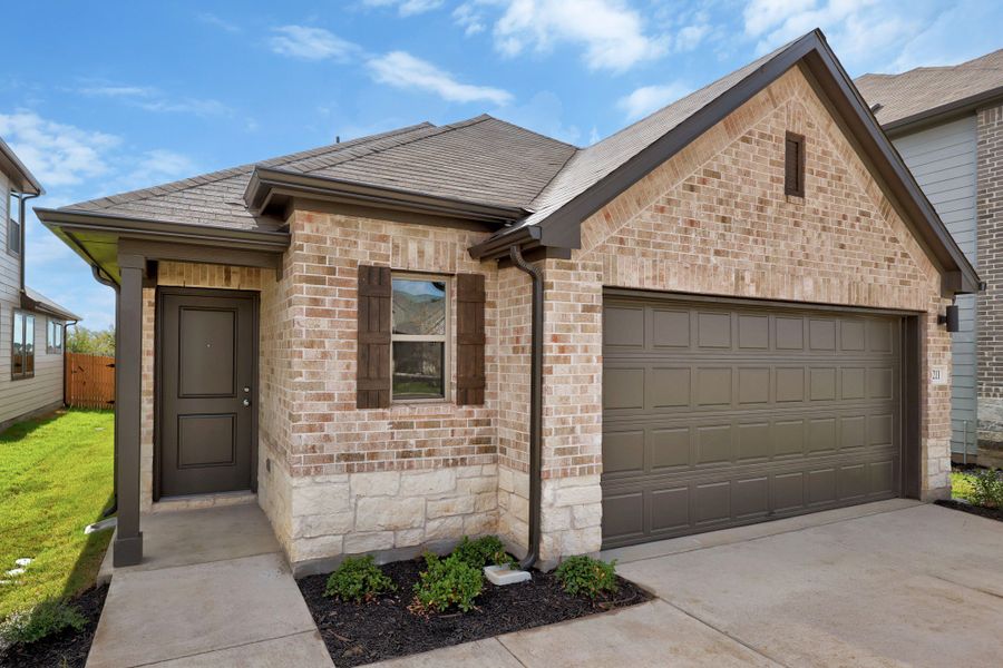 Front exterior of a new home in Trinity Ranch, Elgin, TX, highlighting curb appeal (Image 20).