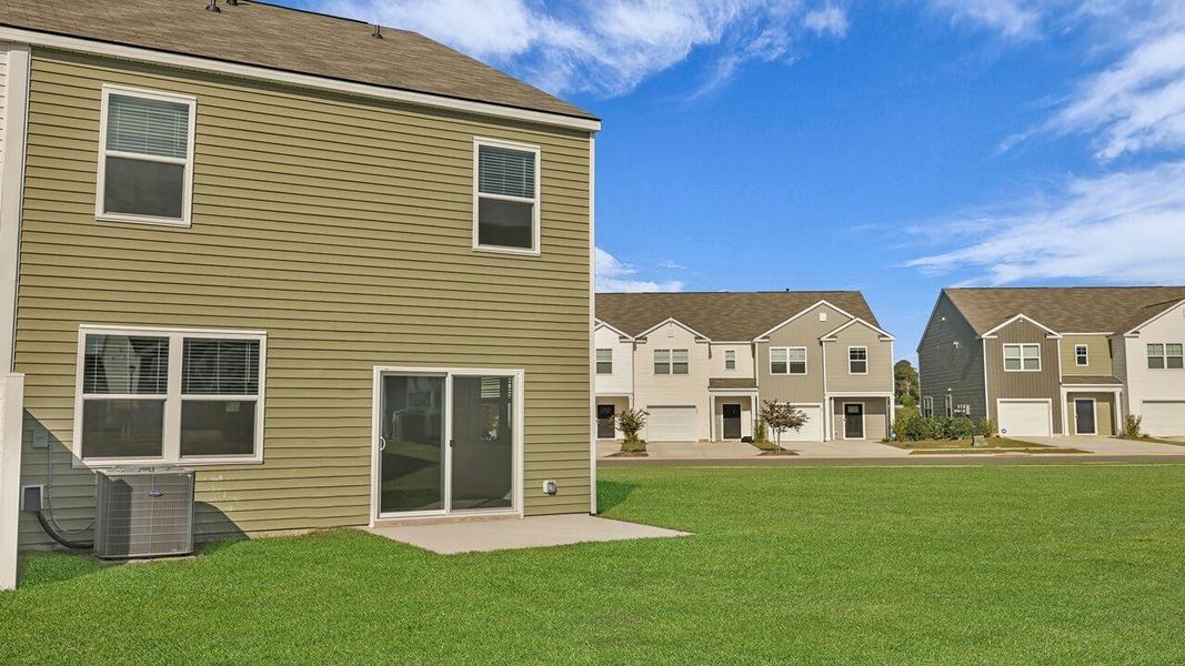 Exterior details and patio area of a home in Carolina Groves Townhomes, Moncks Corner (Image 15).