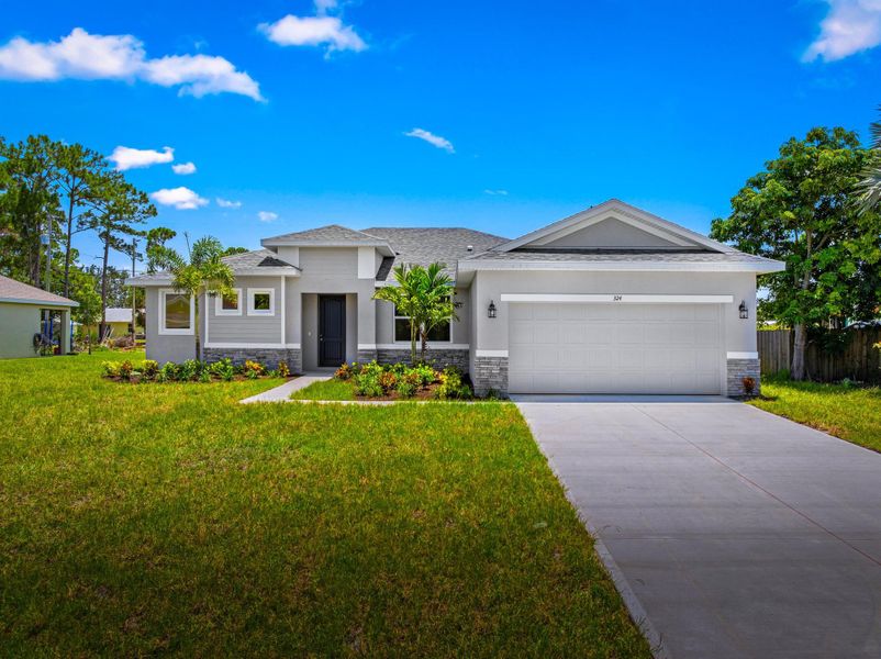 Front exterior of a new home in , Port St. Lucie, FL, highlighting curb appeal (Image 1).