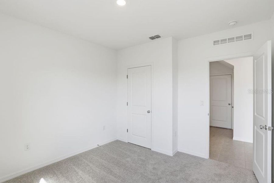 Spacious, unfurnished interior of a new home in Waterstone, Groveland (Image 40). Spacious, unfurnished interior of a new home in Waterstone, Groveland (Image 40).