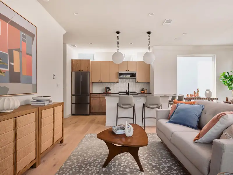 Living room with light wood-style floors and recessed lighting