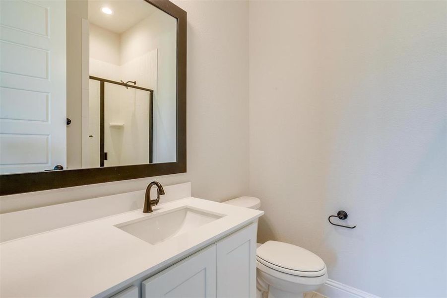 Bathroom with vanity and toilet