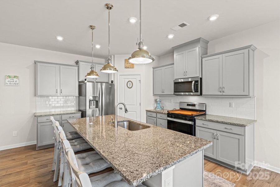 Furnished interior view inside a new home in Waxhaw Landing, Monroe (Image 12).