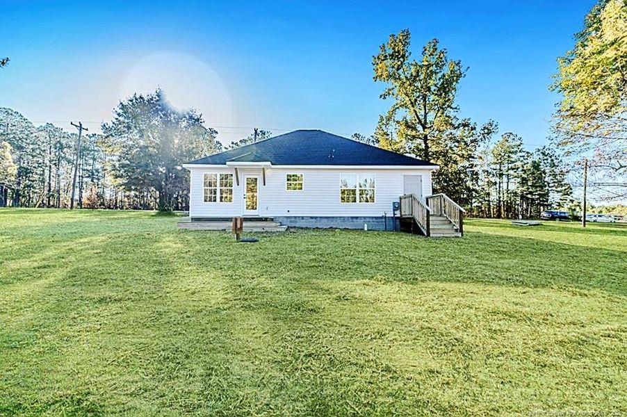 Rear of home - Enhanced with grass.