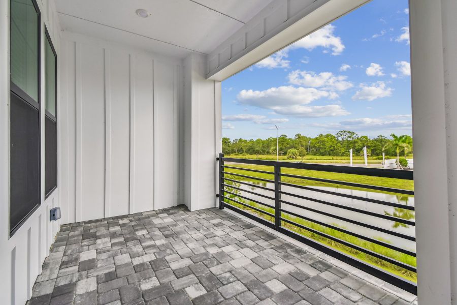 Exterior details and patio area of a home in Emerald Landing at Waterside at Lakewood Ranch – City Homes, Sarasota (Image 3).