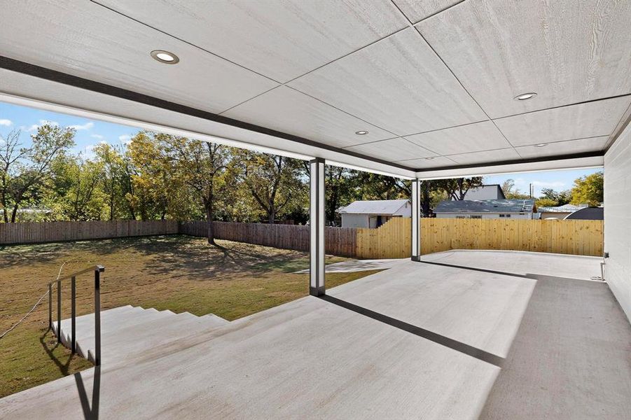 Fenced backyard with a patio