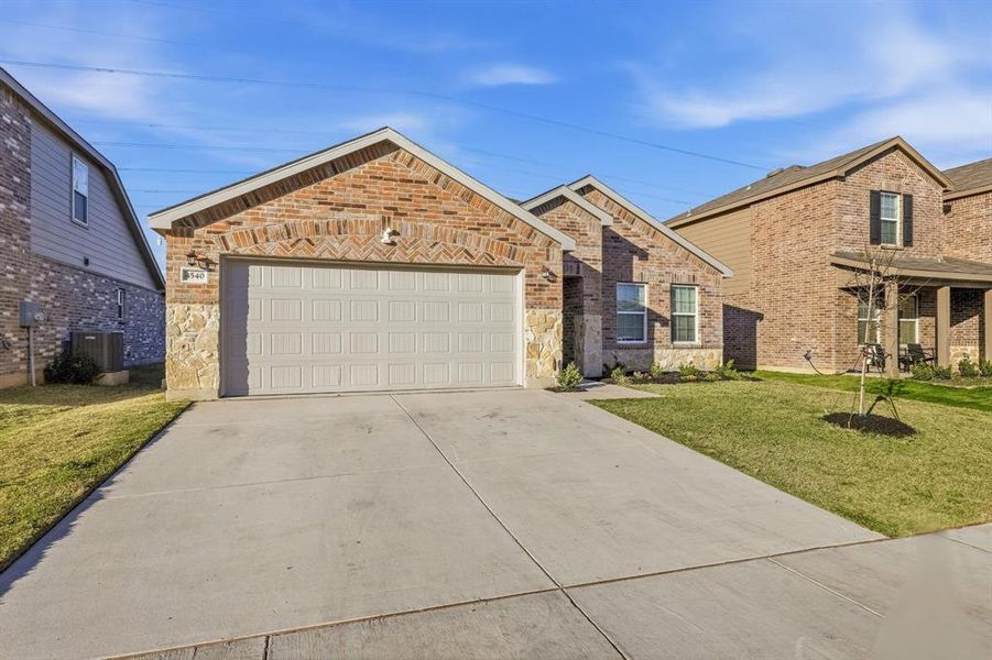 Front exterior of a new home in Newberry Point, Fort Worth, TX, highlighting curb appeal (Image 2).