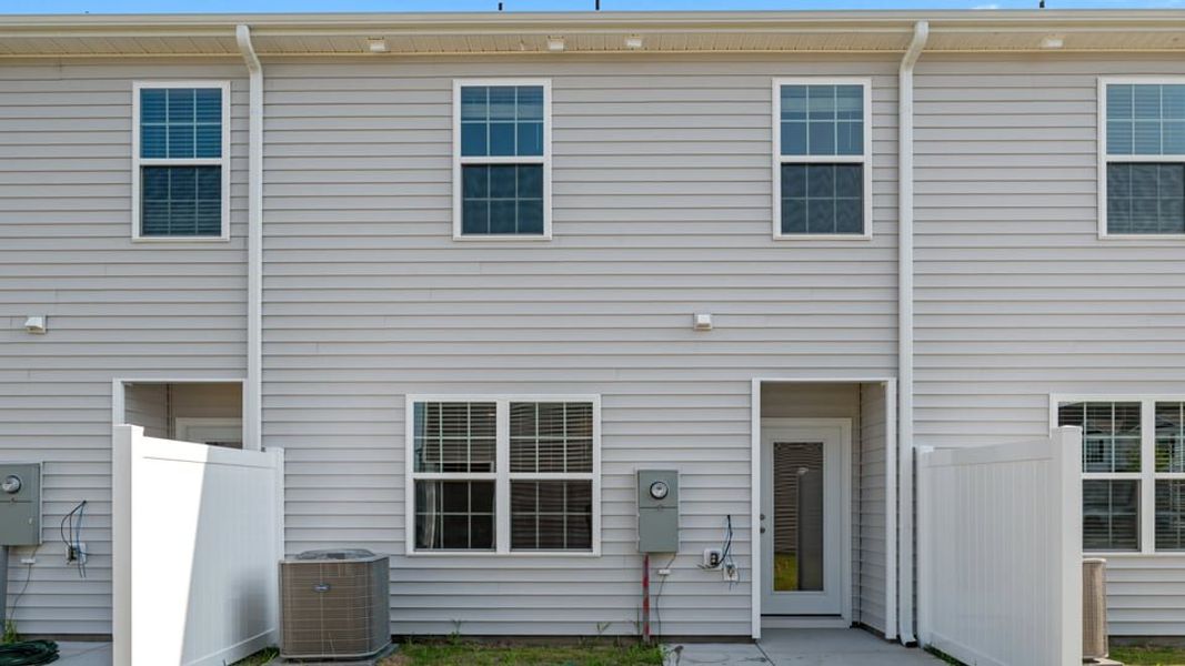 Exterior details and patio area of a home in The Townes at Ridgewood Farms, Winterville (Image 22).